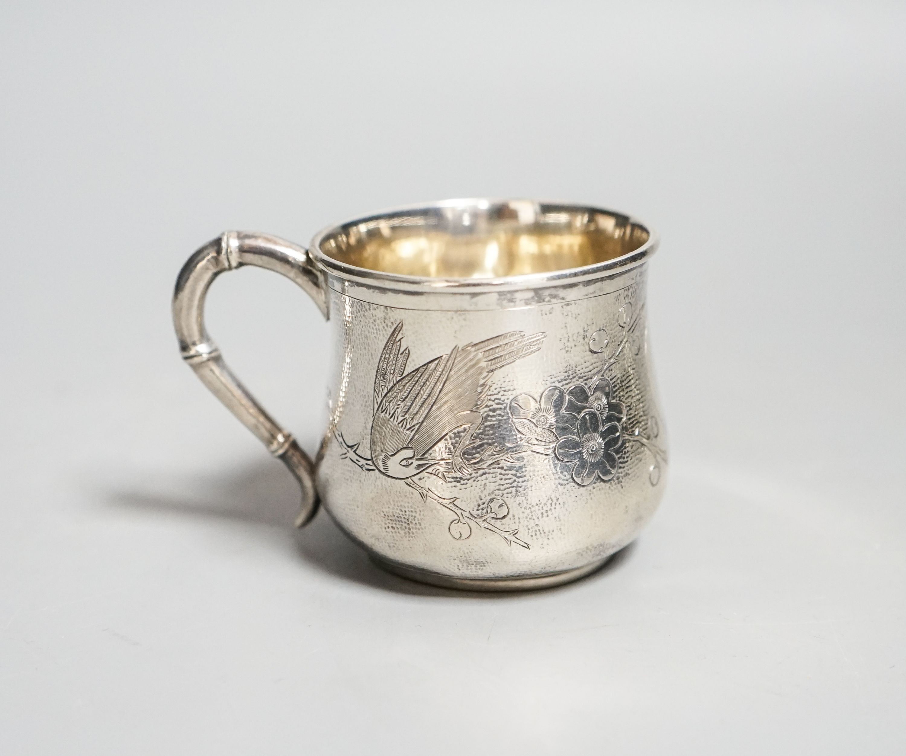 A Chinese white metal christening mug, by Zee Sung, 55mm.